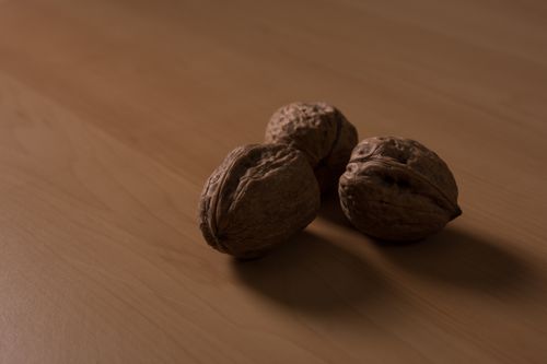 Free Nuts on a wooden table Stock Photo