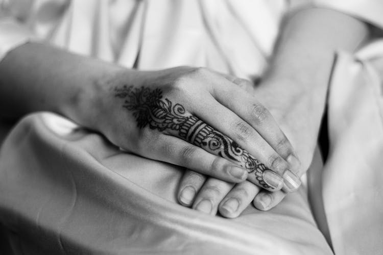 Close Up Of Woman Hands And Tattoo