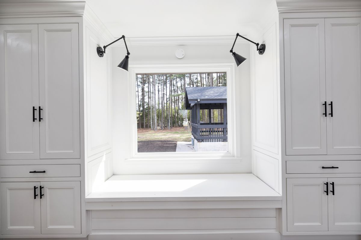 Window seat made from flat-pack cabinets with an upholstered top