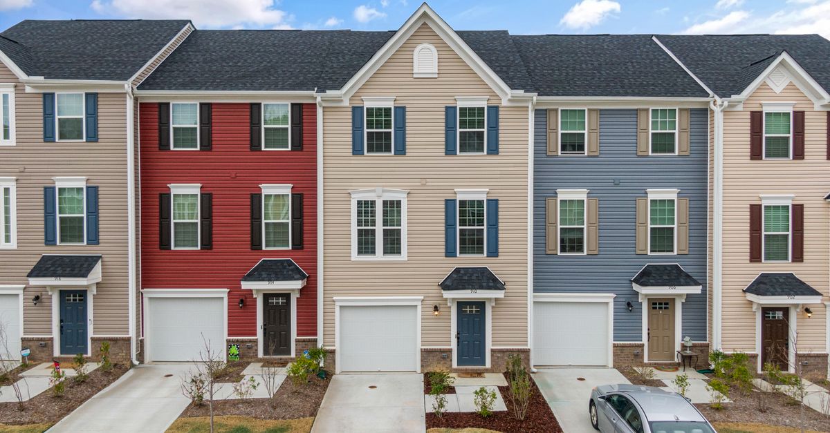 Bright townhouses showcasing diverse colors and modern architecture in Fuquay-Varina, NC.