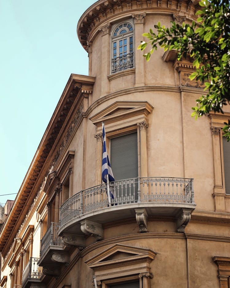 White And Blue Flag Hanging On The Balcony 