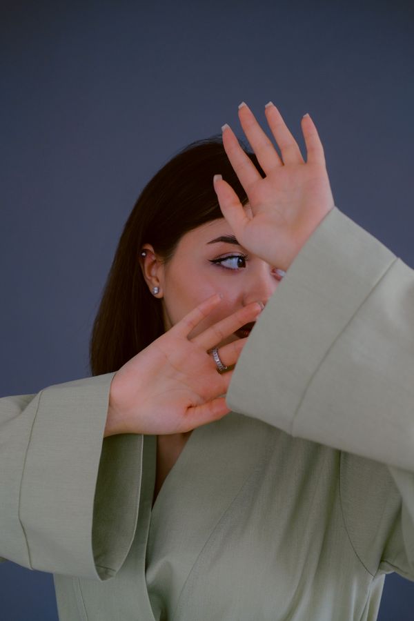 Woman in a sage green outfit — Nuta Sorokina on Pexels