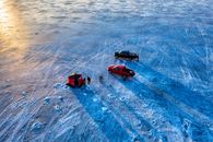 Aerial View of People Ice Fishing in a Frozen Body of Water