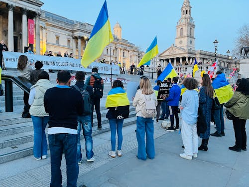 People rallying in front of an Administration Building 