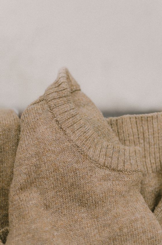 Oatmeal lambswool crew knit, close view of the rib collar — Александр Трубицын on Pexels