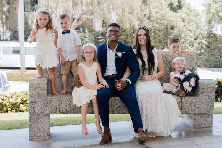 A Family On A Marble Bench