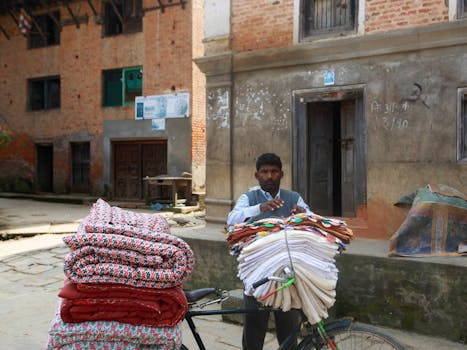 A Man Transporting Textiles with a Bicycle