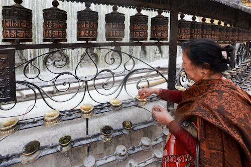 Elderly Woman doing Rituals 