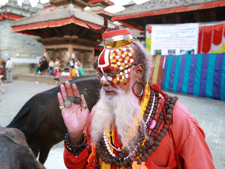 Man With Colorful Clothes, Hat And Painted Face