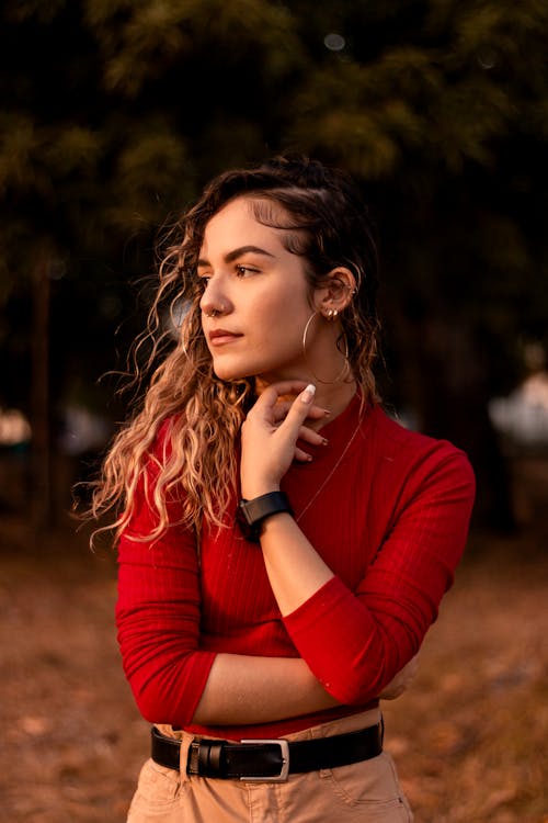 A Woman in Red Long Sleeve Shirt