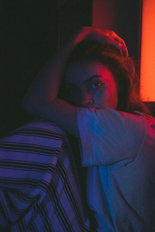 Woman in Gray Shirt and White and Black Stipe Pajama