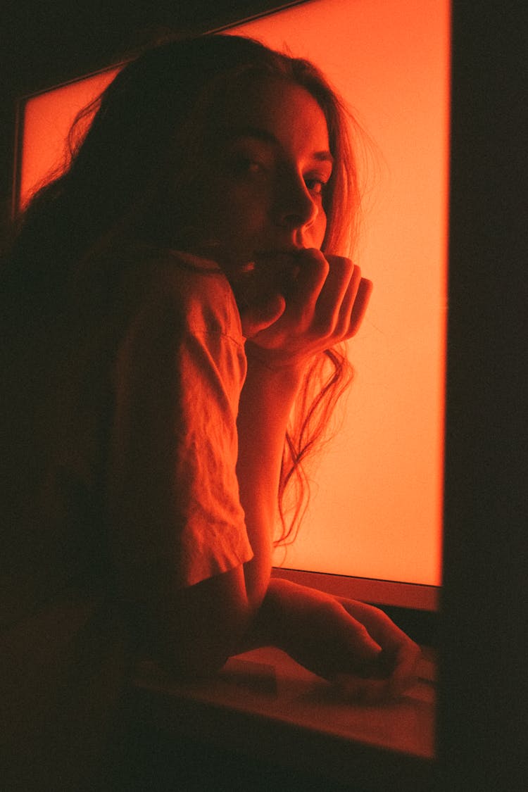 Portrait Of Woman In Red Lighting