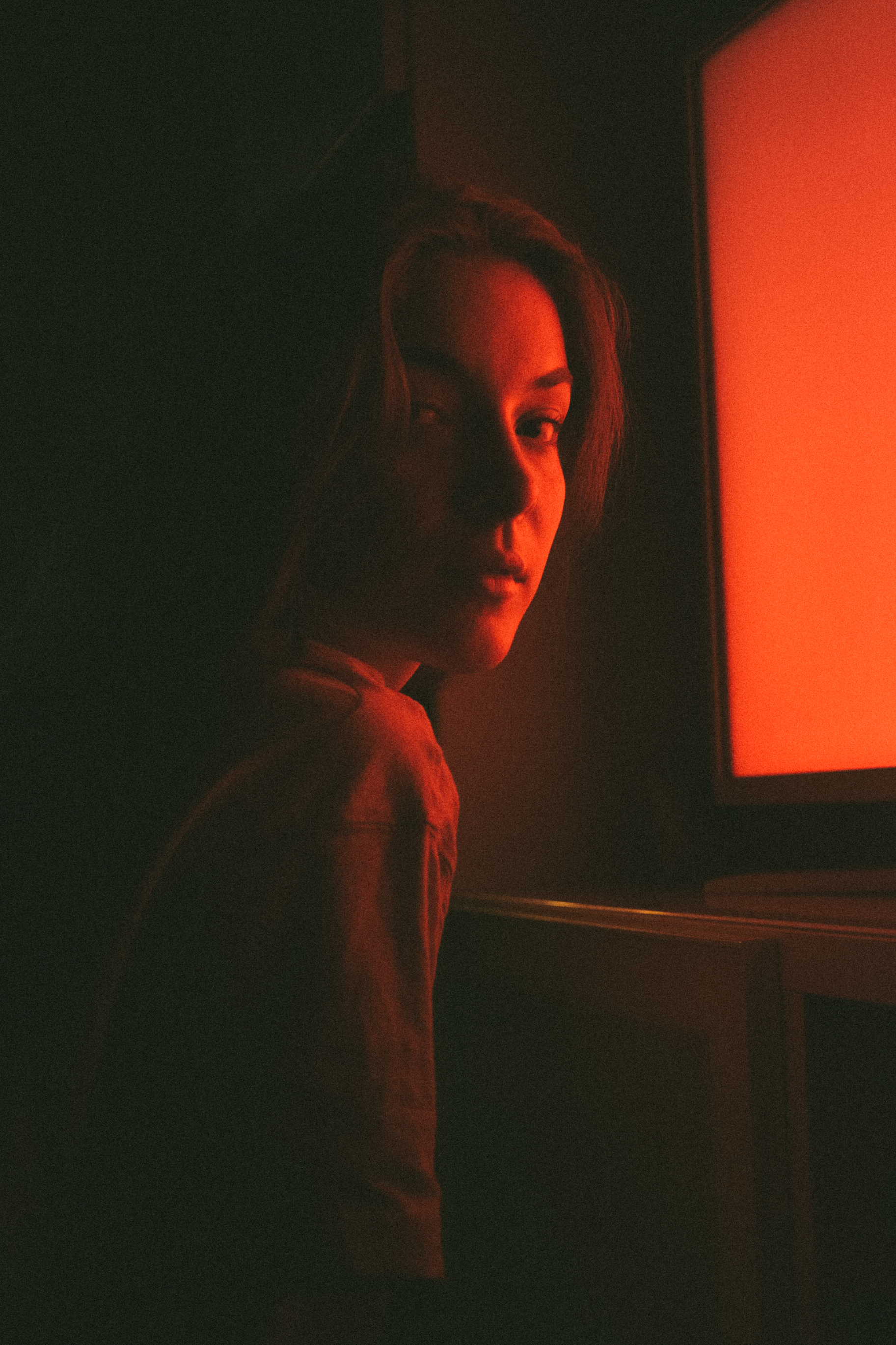 Woman Reflecting Orange Light on Face · Free Stock Photo
