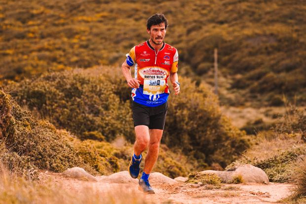 Trail runner moving through rugged terrain — photo by RUN 4 FFWPU on Pexels