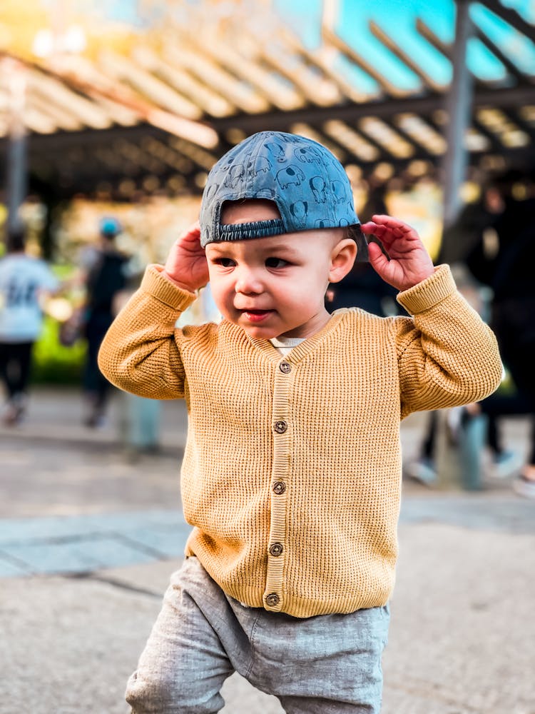 A Boy Wearing A Cap