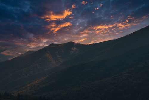 Free Breathtaking sunset over the Smoky Mountains with vivid skies and silhouetted peaks. Stock Photo