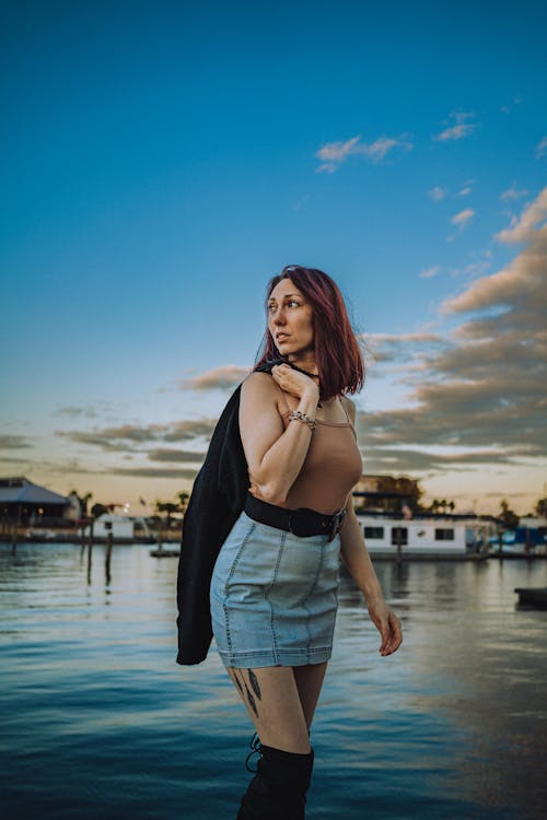 A Woman Wearing Denim Skirt