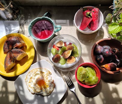 Bright and healthy breakfast with fruits, bagel, and egg, beautifully arranged.