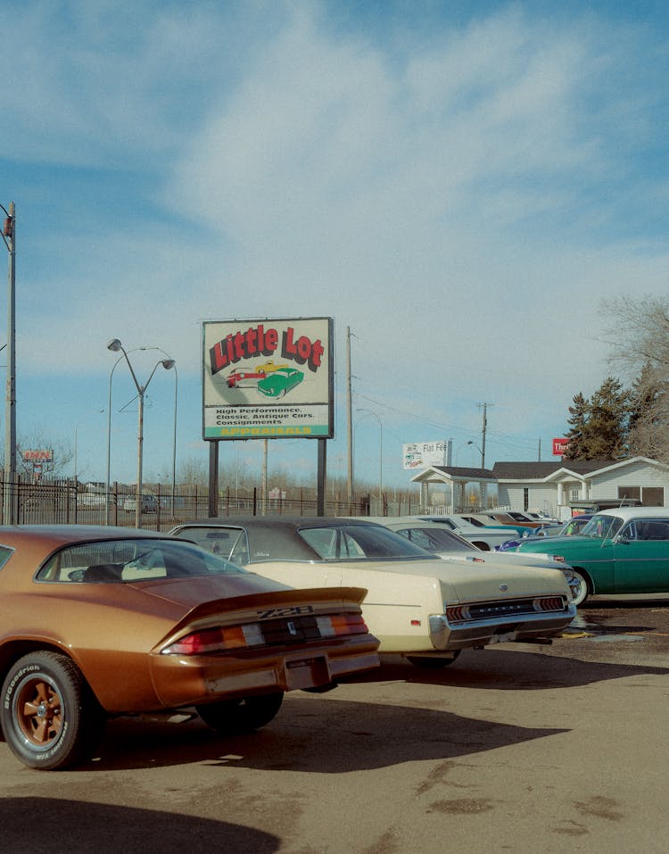 Classic Cars Parked In Parking Lot