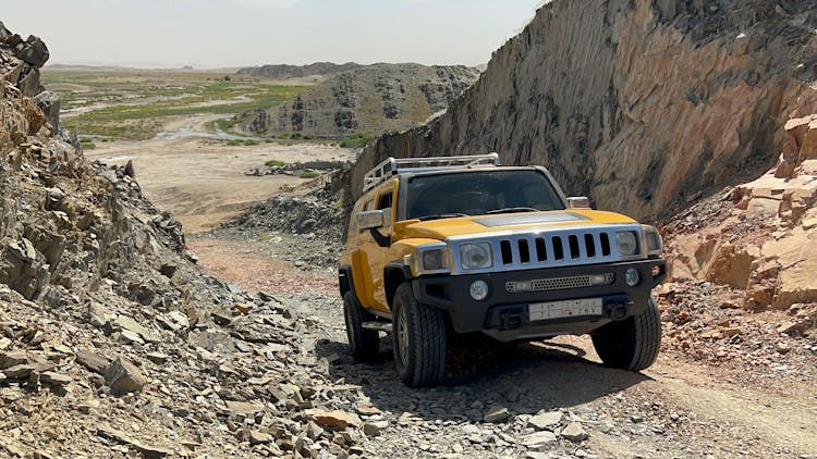 Yellow Suv Car On An Off Road 