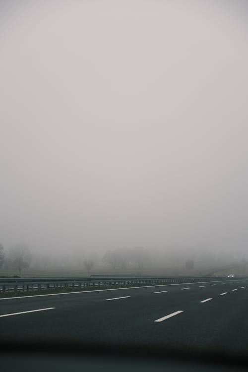 Gray Concrete Road With Fog