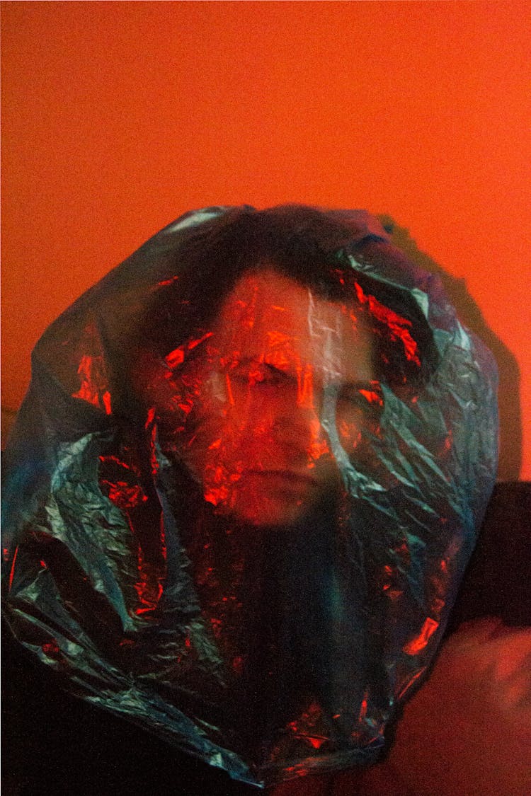 Man's Head Covered In Plastic Bag 