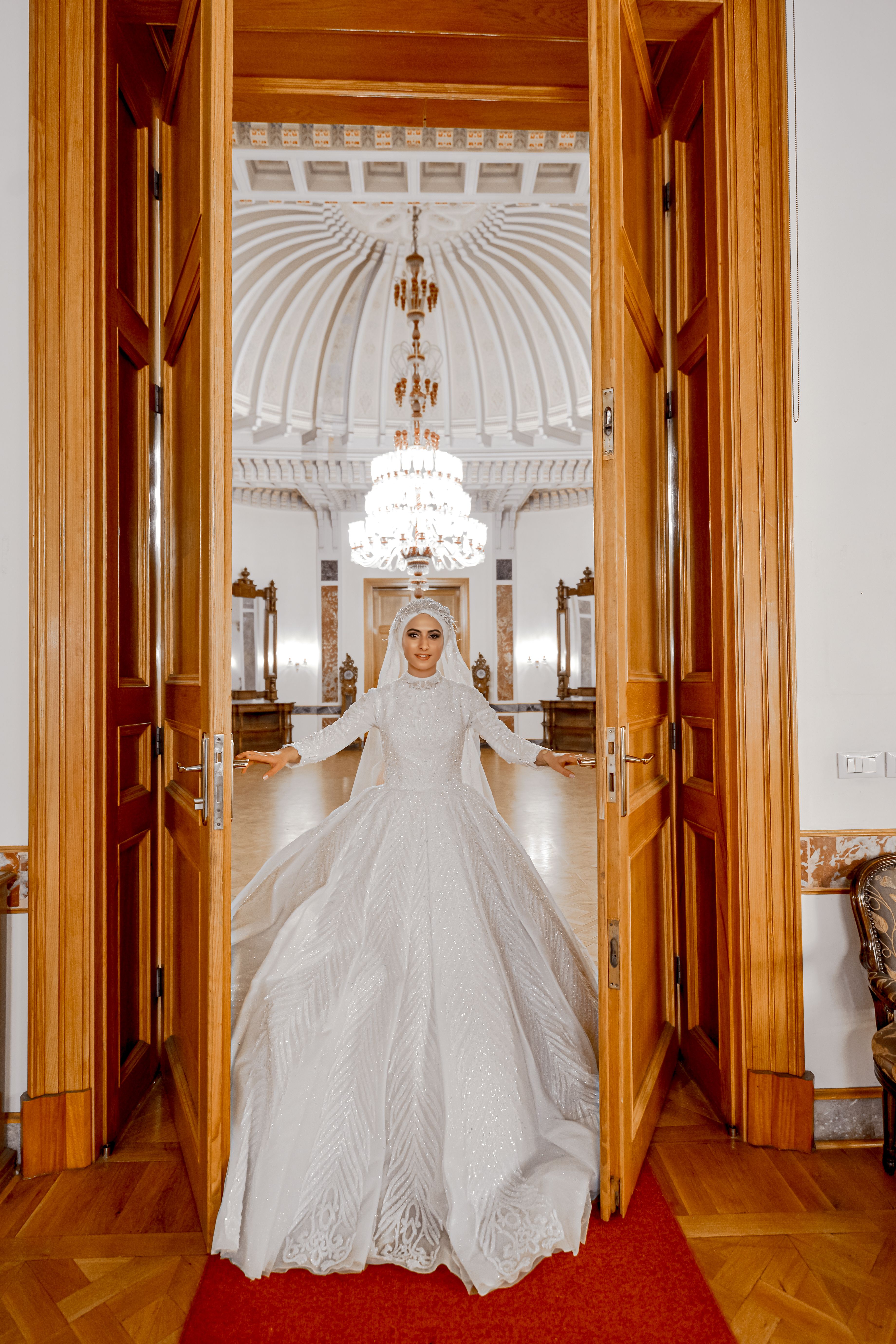 Stunning bridal portrait in an opulent interior setting, exuding elegance and luxury.