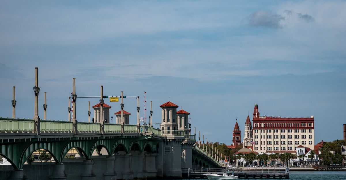 Iconic Bridge of Lions with historic buildings in St. Augustine, Florida.
