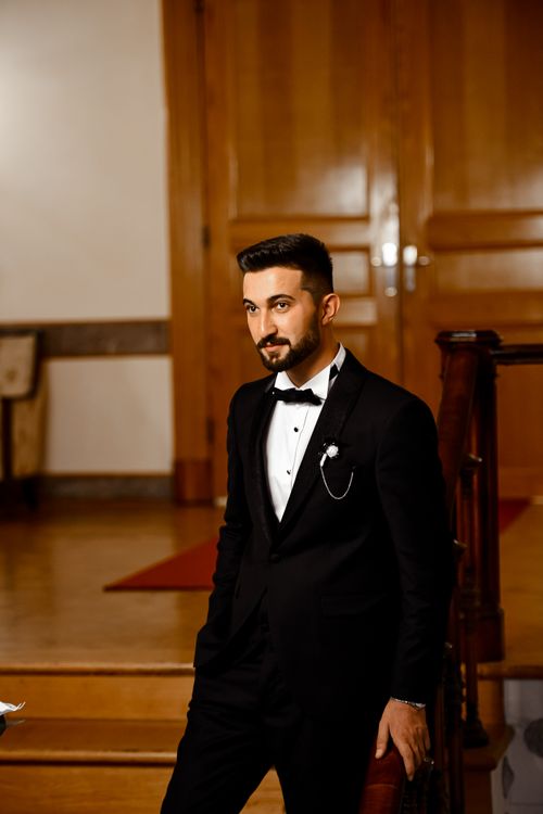 Free Portrait of a bearded man in formal attire at an elegant indoor setting. Stock Photo