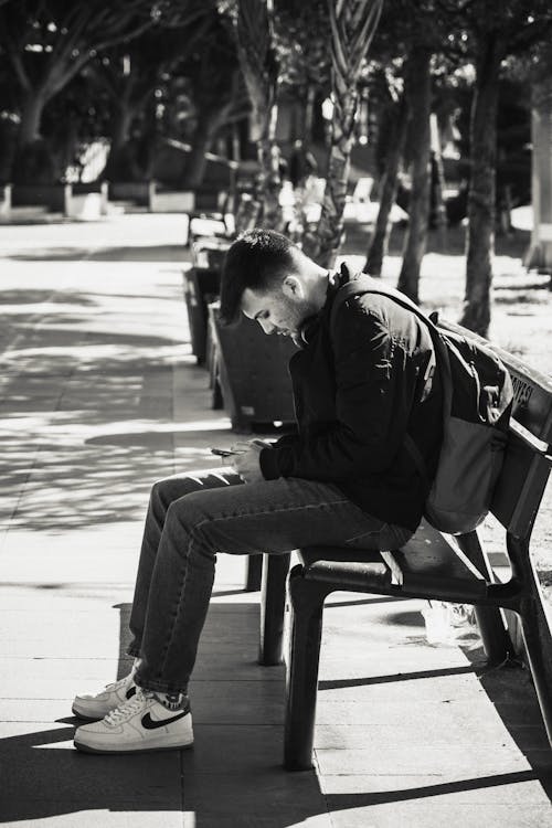 Man Sitting on a Bench