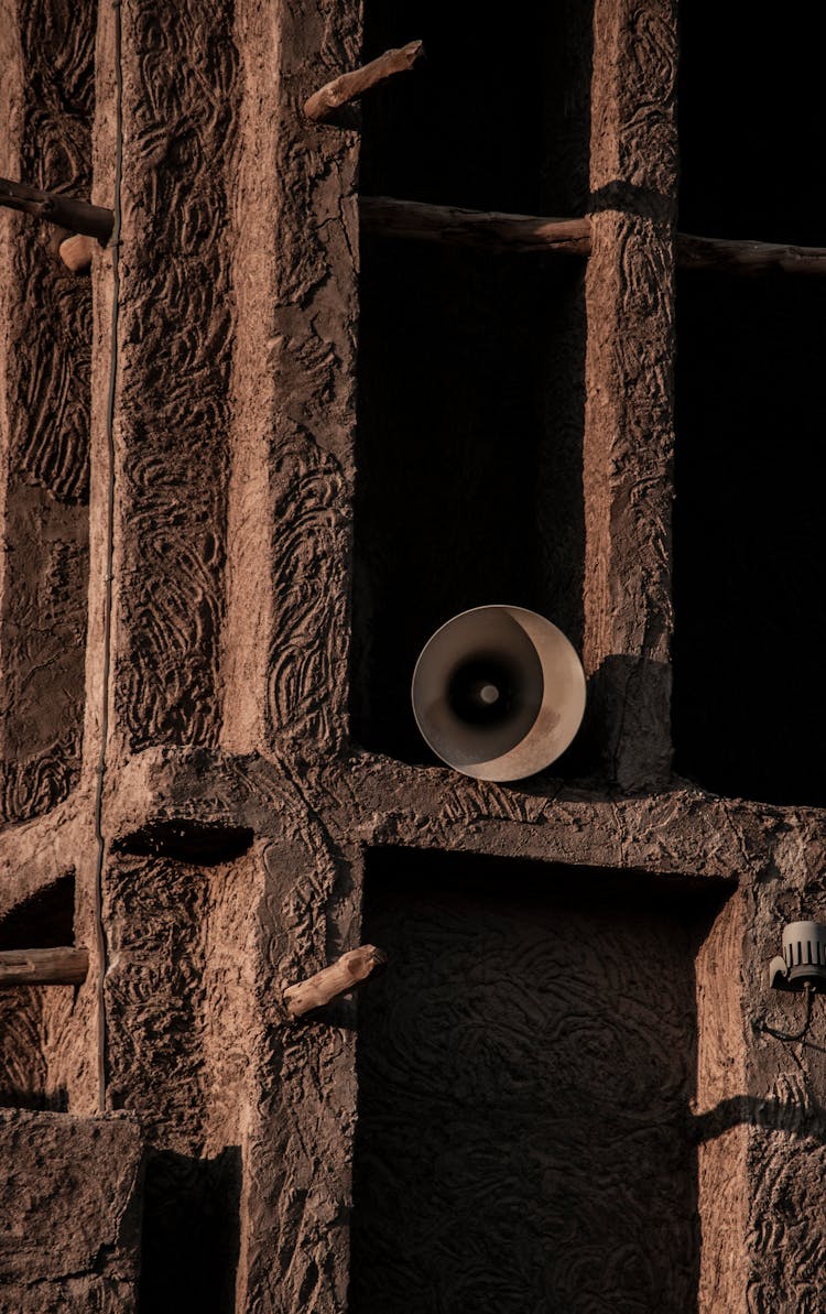 Old Rusty Speaker On A Wooden Post