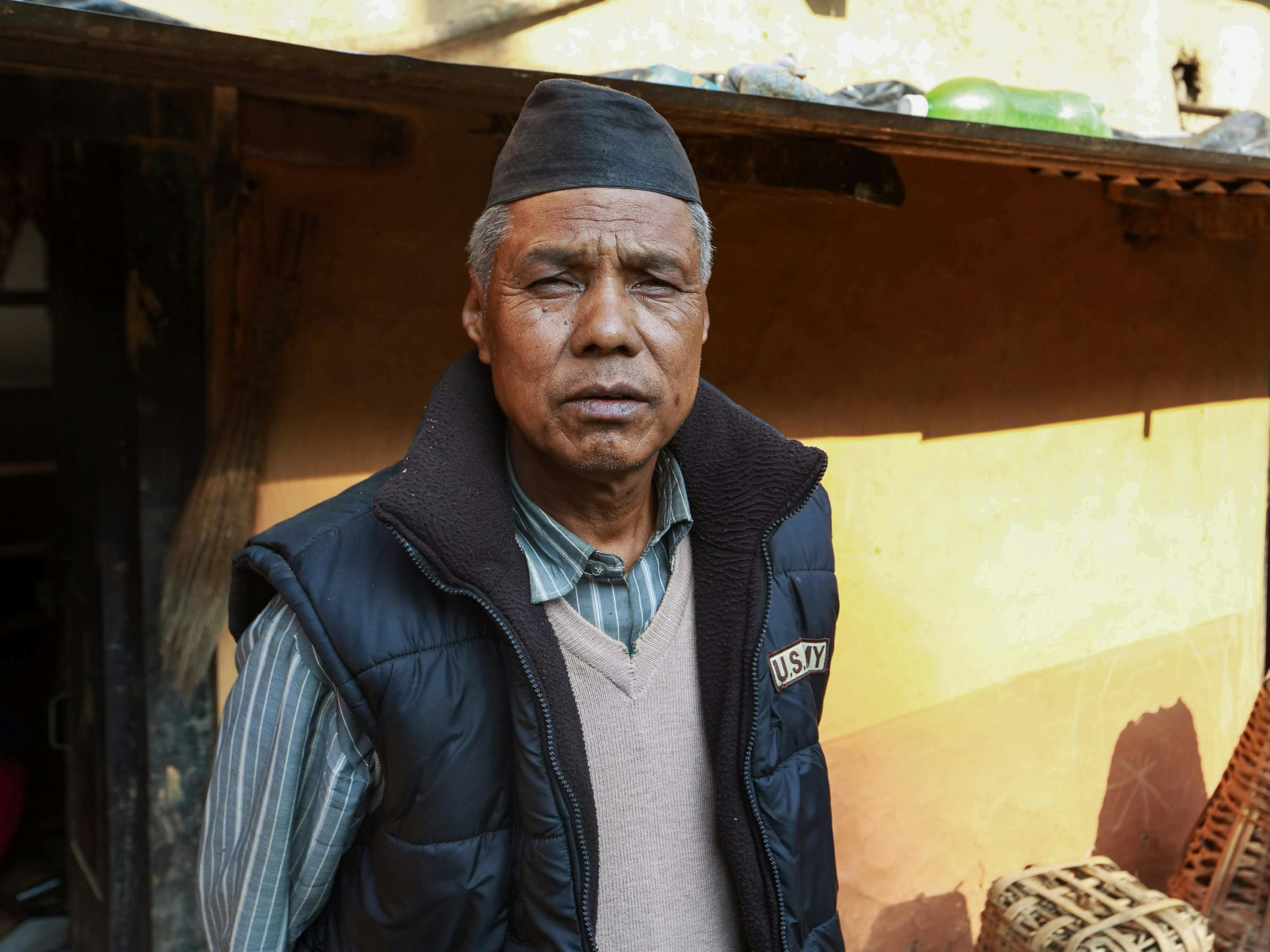 elderly man in waistcoat