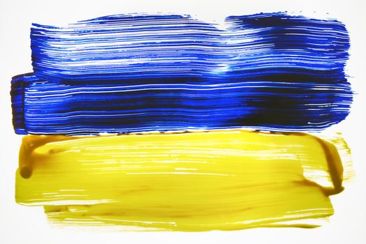 Vibrant abstract art featuring blue and yellow paint strokes on white background.