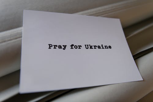 Free A Pray for Ukraine Message Written on a White card Stock Photo
