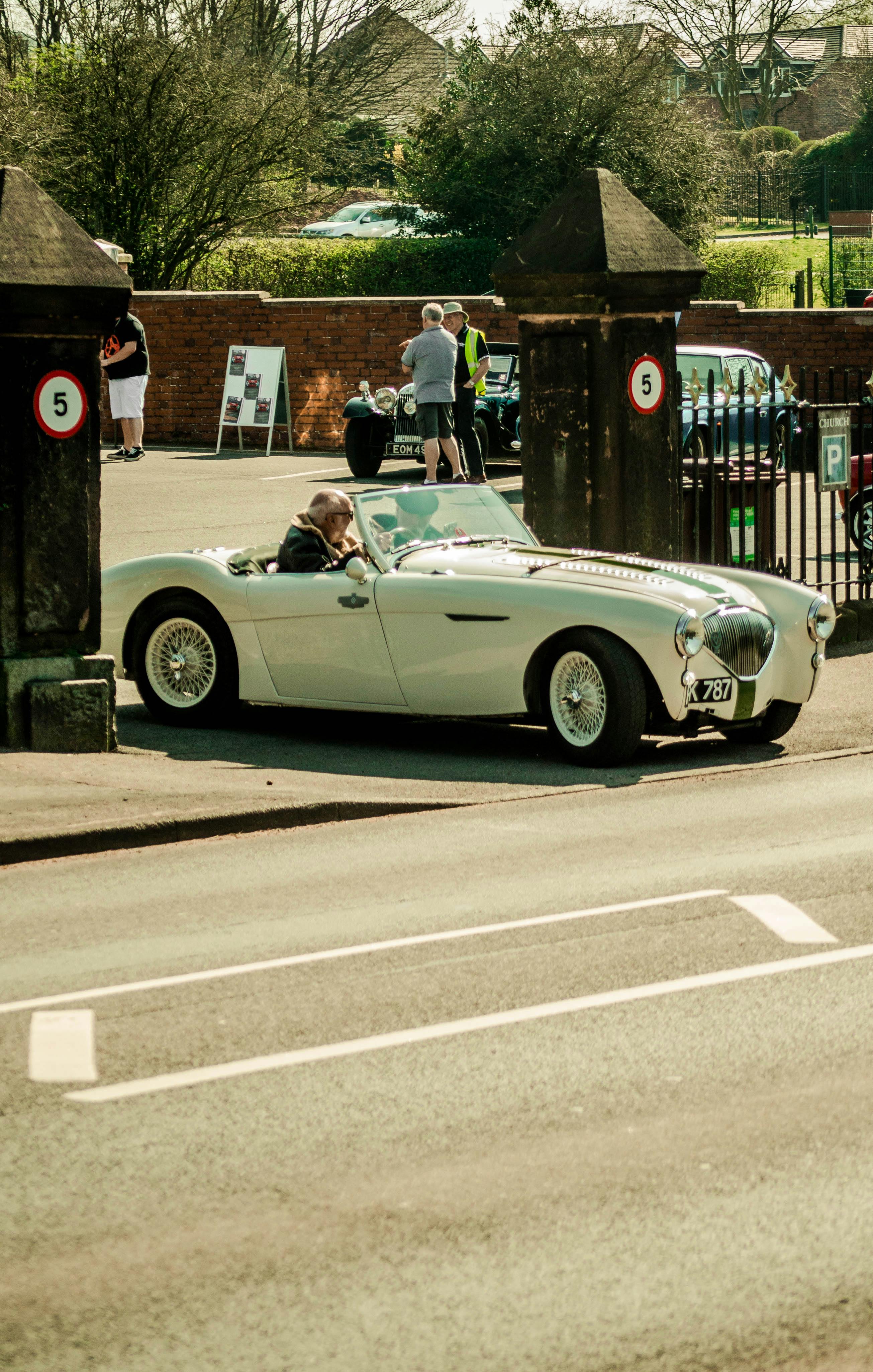 A Vintage Car in a City · Free Stock Photo