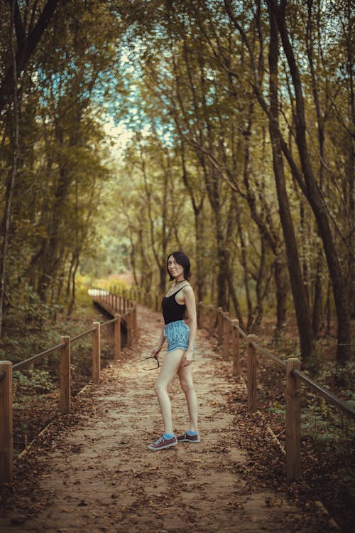 Woman in Black Sleeveless Top and Shorts