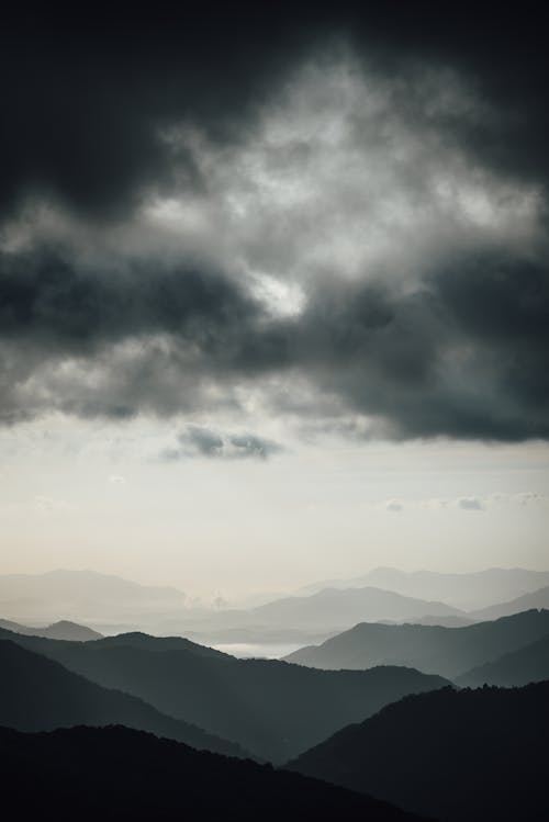 Dark Clouds Over Silhouette of Mountains 