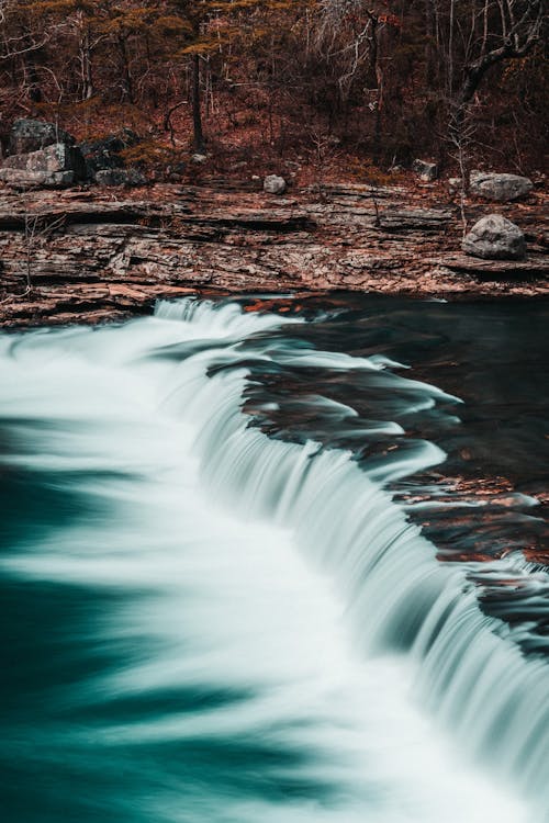 Free Cascading of Waterfalls on a Stream  Stock Photo