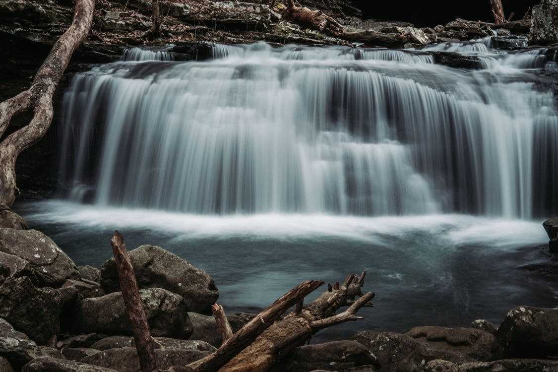 Waterfall And Rocks A Cascading Waterfalls Near Rocks · Free Stock Photo