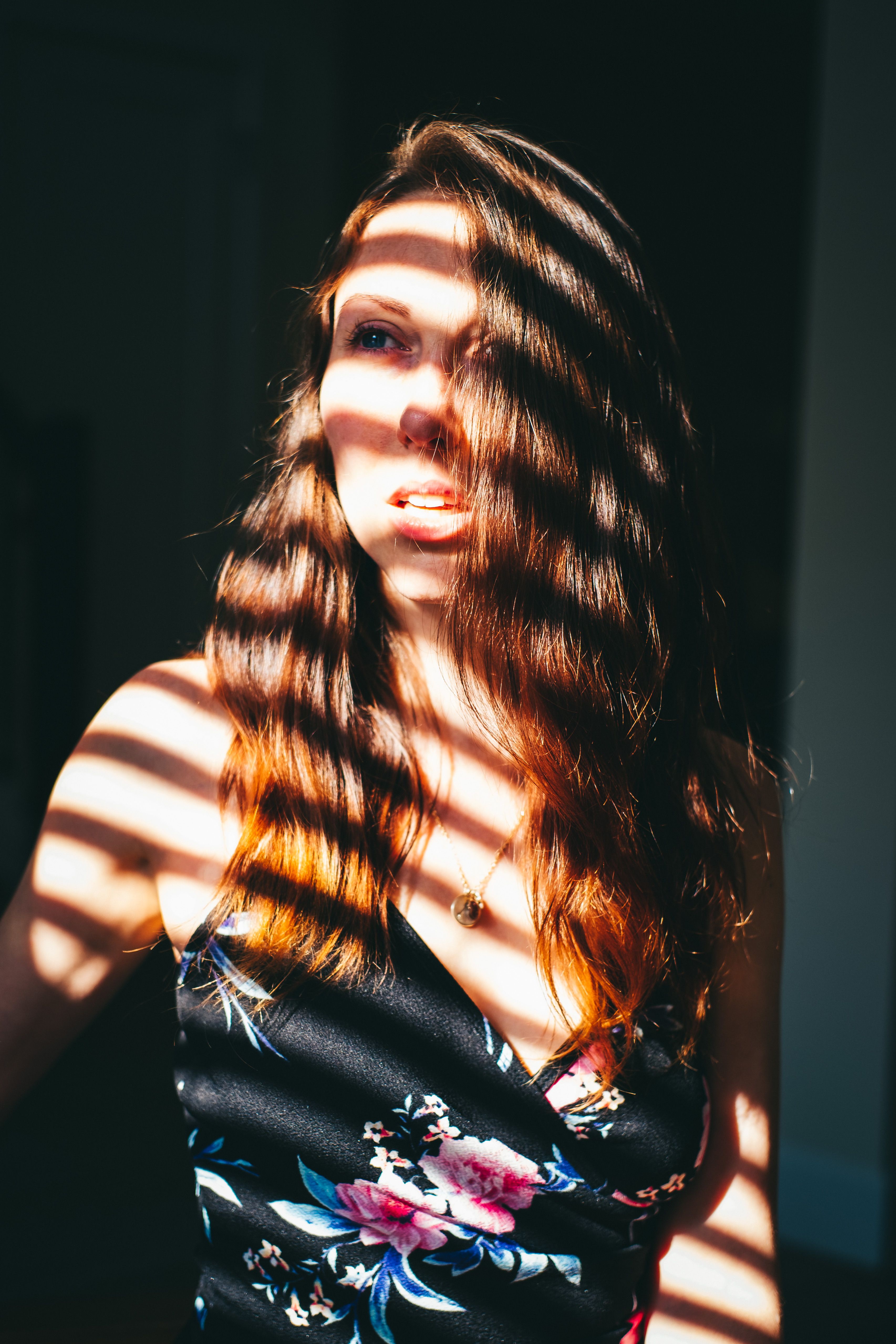 Portrait of a Woman in Floral Top · Free Stock Photo