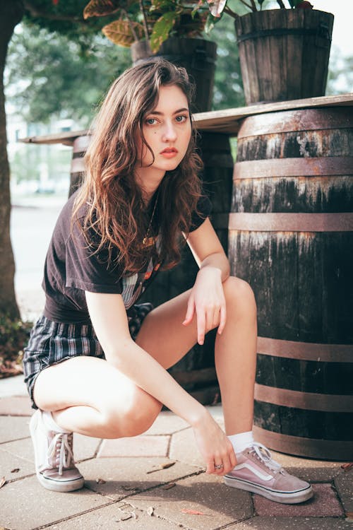 Woman in Black Shirt and Shorts