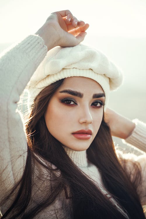 Brunette Woman Posing in White Sweater and Beret