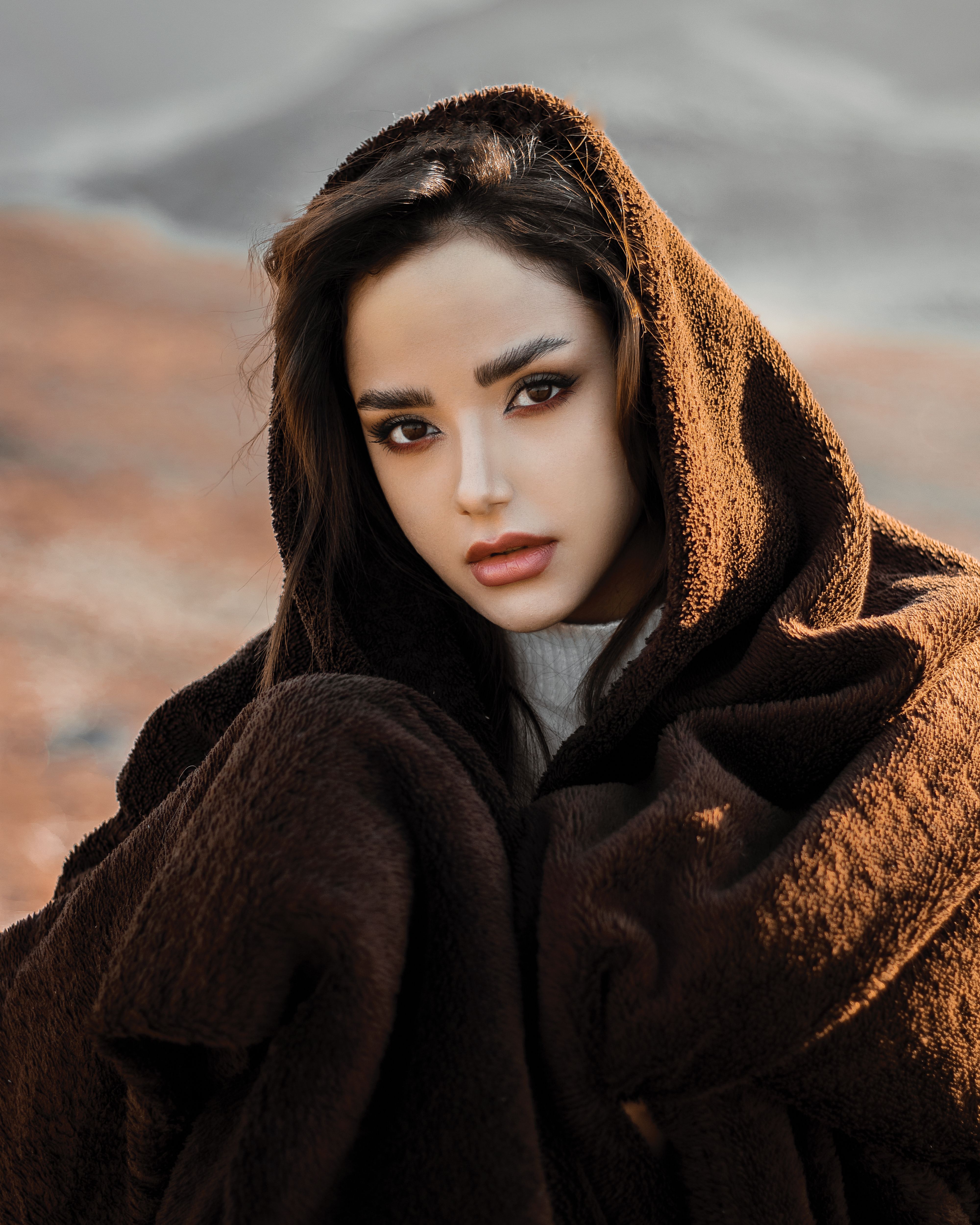 Close-Up Shot of a Woman Wearing a Brown Coat · Free Stock Photo