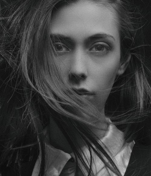 Free Striking black and white portrait capturing a woman with dramatic, windblown hair. Stock Photo