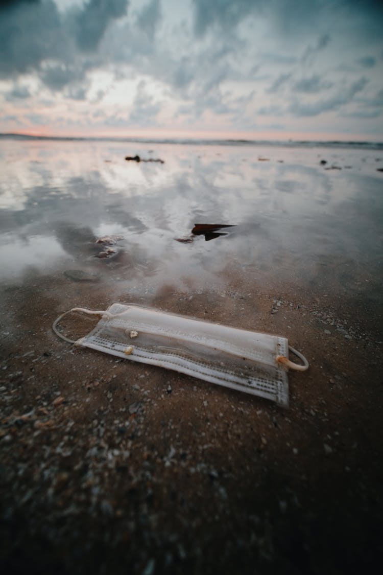 Face Mask Waste On Sand 