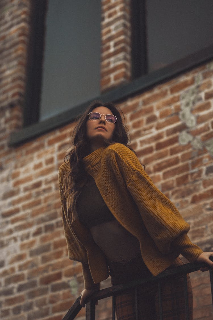 Woman Leaning Over Railing 