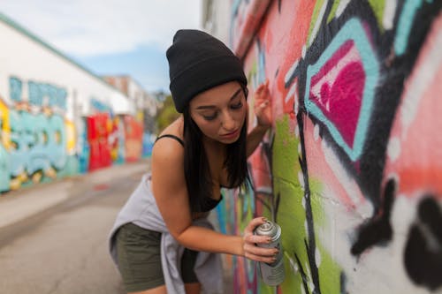 Alluring Woman holding a Can of Spray Paint 