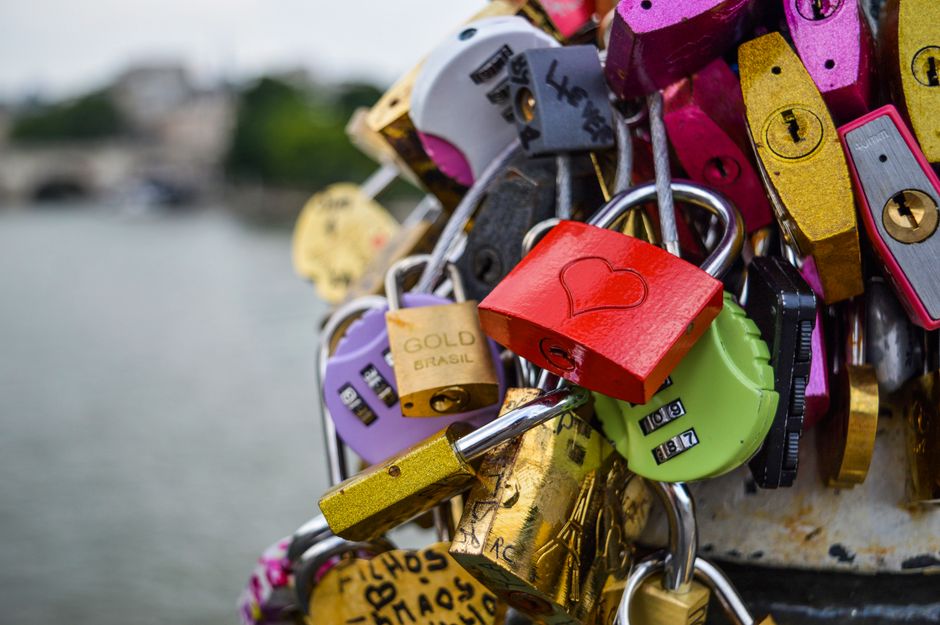 Photo by Gotta Be Worth It on Pexels Vibrant love locks attached to a bridge in Paris symbolizing romance and commitment.