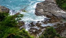 Waves crashing on Boulders