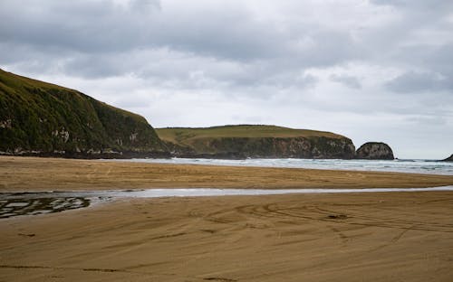 Clouds over Beach and Cliffs